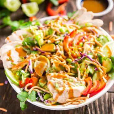 Asian Salad with Peanut Dressing is crisp, refreshing and full of delicious flavors- this is the perfect healthy main dish but can also be made to feel a crowd as a side dish or starter that will have people fighting for seconds!