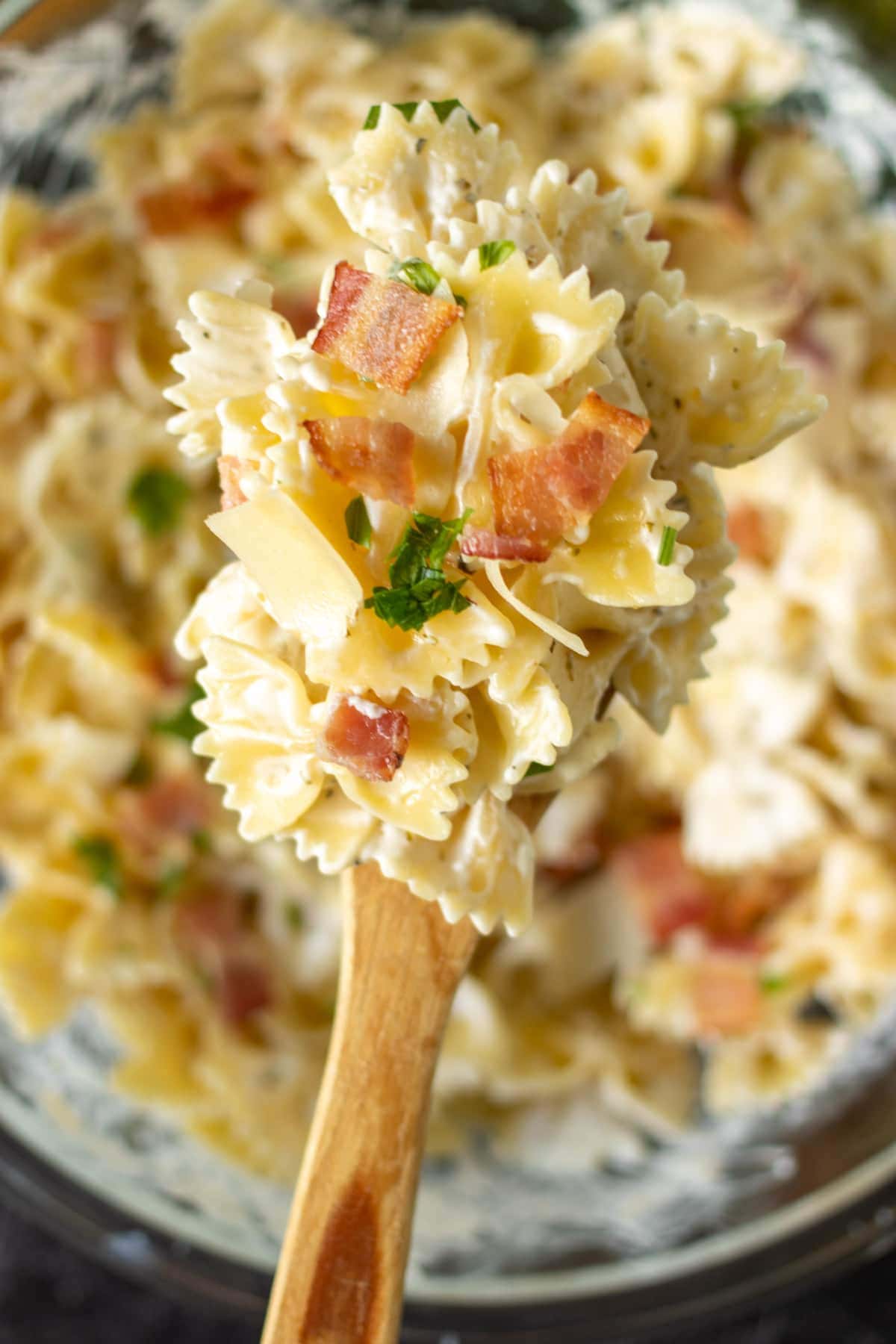 wooden spoon full of bowtie pasta