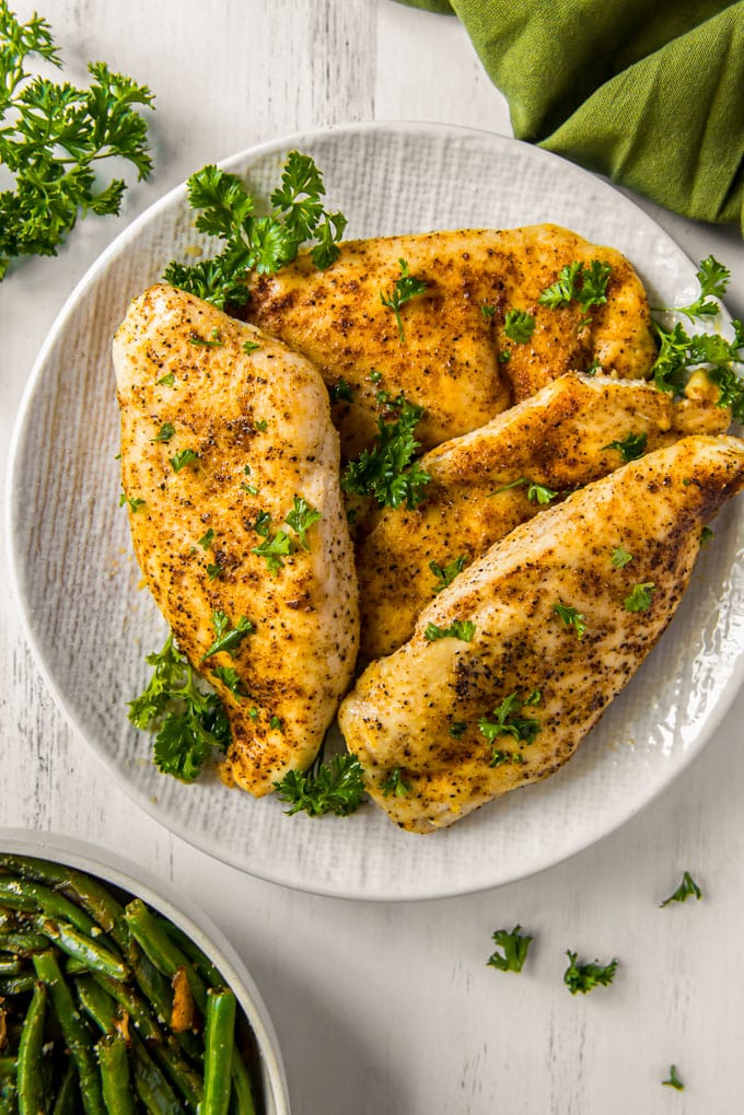 chicken breasts on a white platter