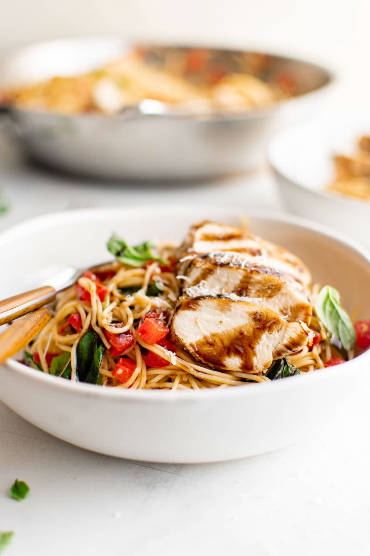 Bruschetta pasta with chicken in a small bowl.