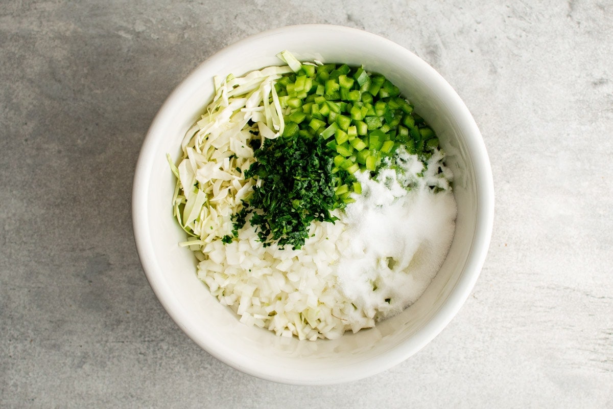 ingredients for cabbage salad in a large bowl