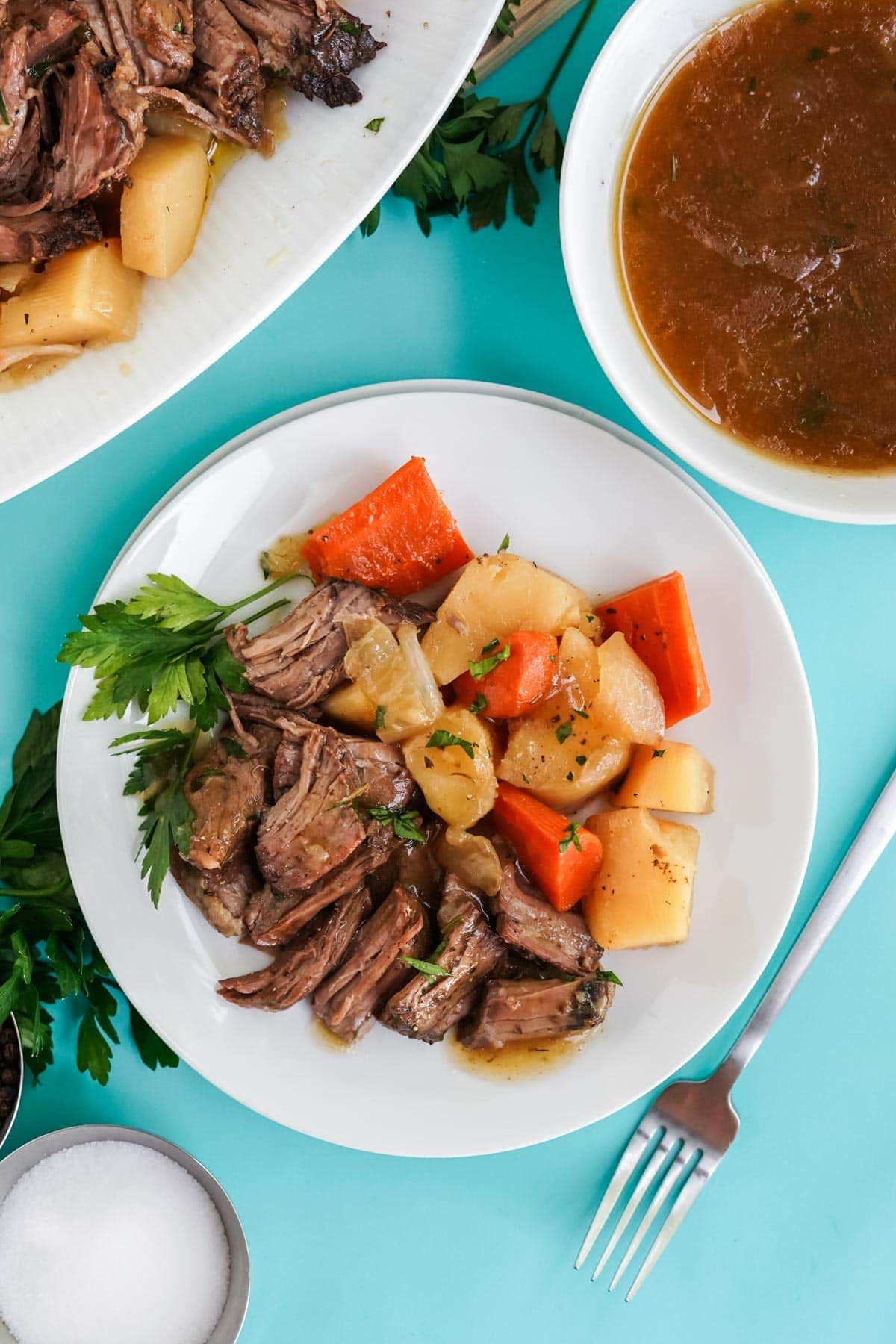 overhead view of pot roast and vegetables on a plate