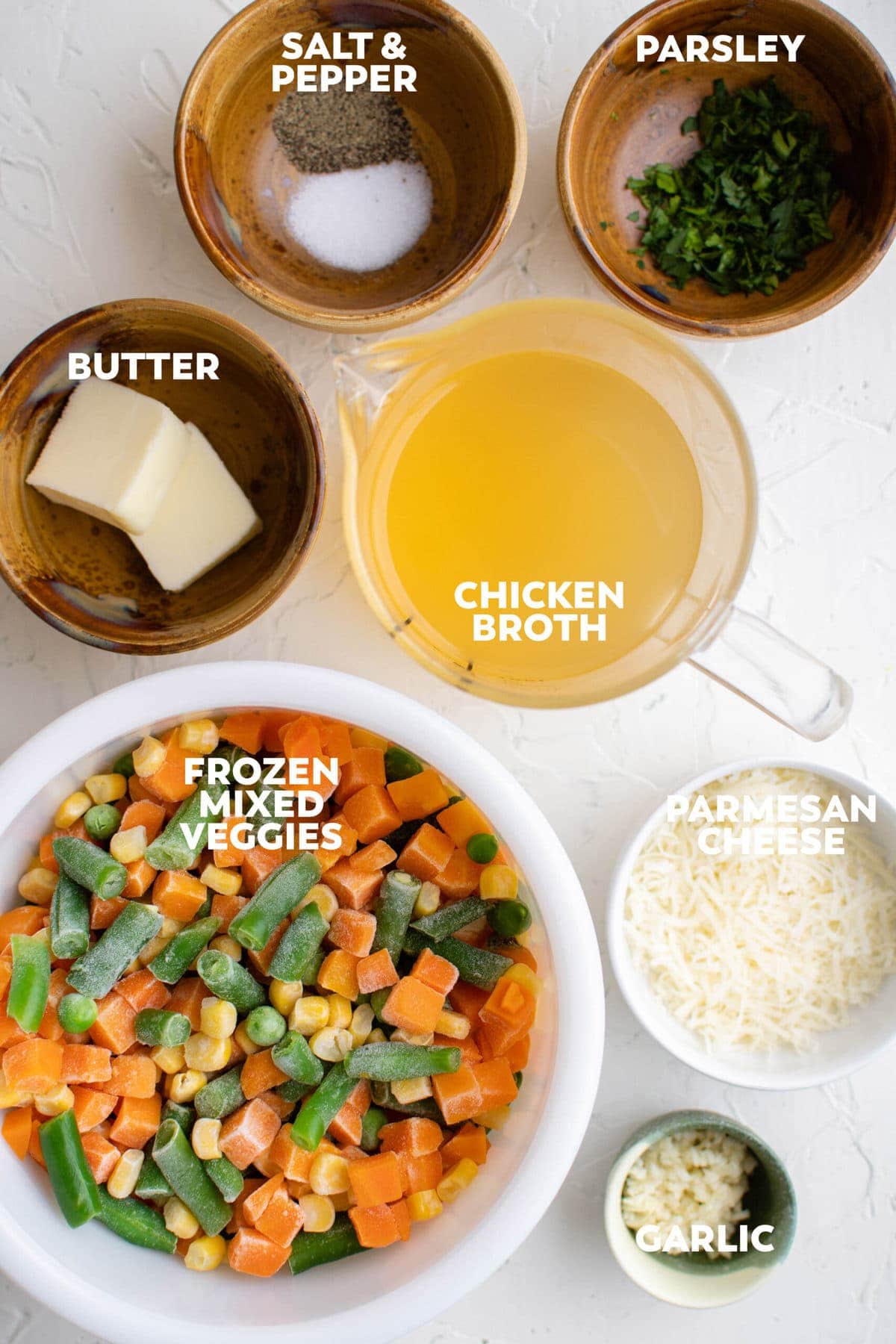 frozen mixed vegetables, butter, chicken broth, parsley, garlicm parmesan cheese, brown dishes, white dishes