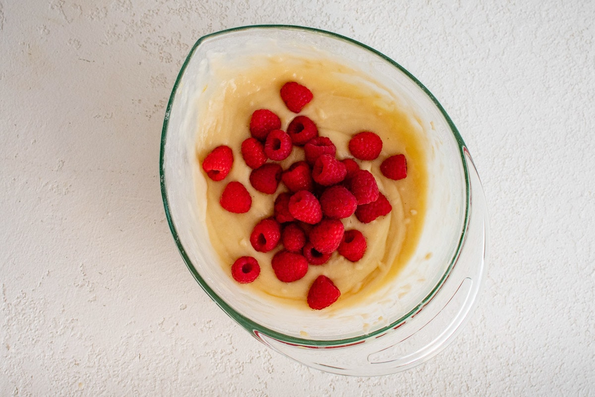 Quick bread batter with fresh raspberries.