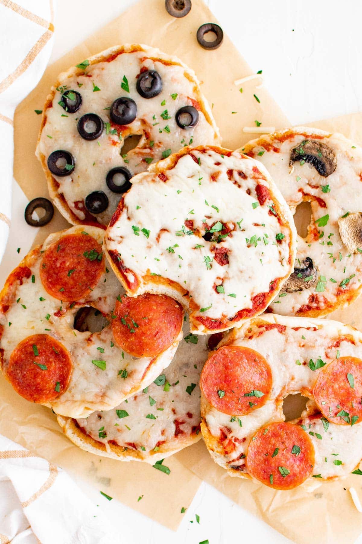 bagels topped with cheese and pizza toppings