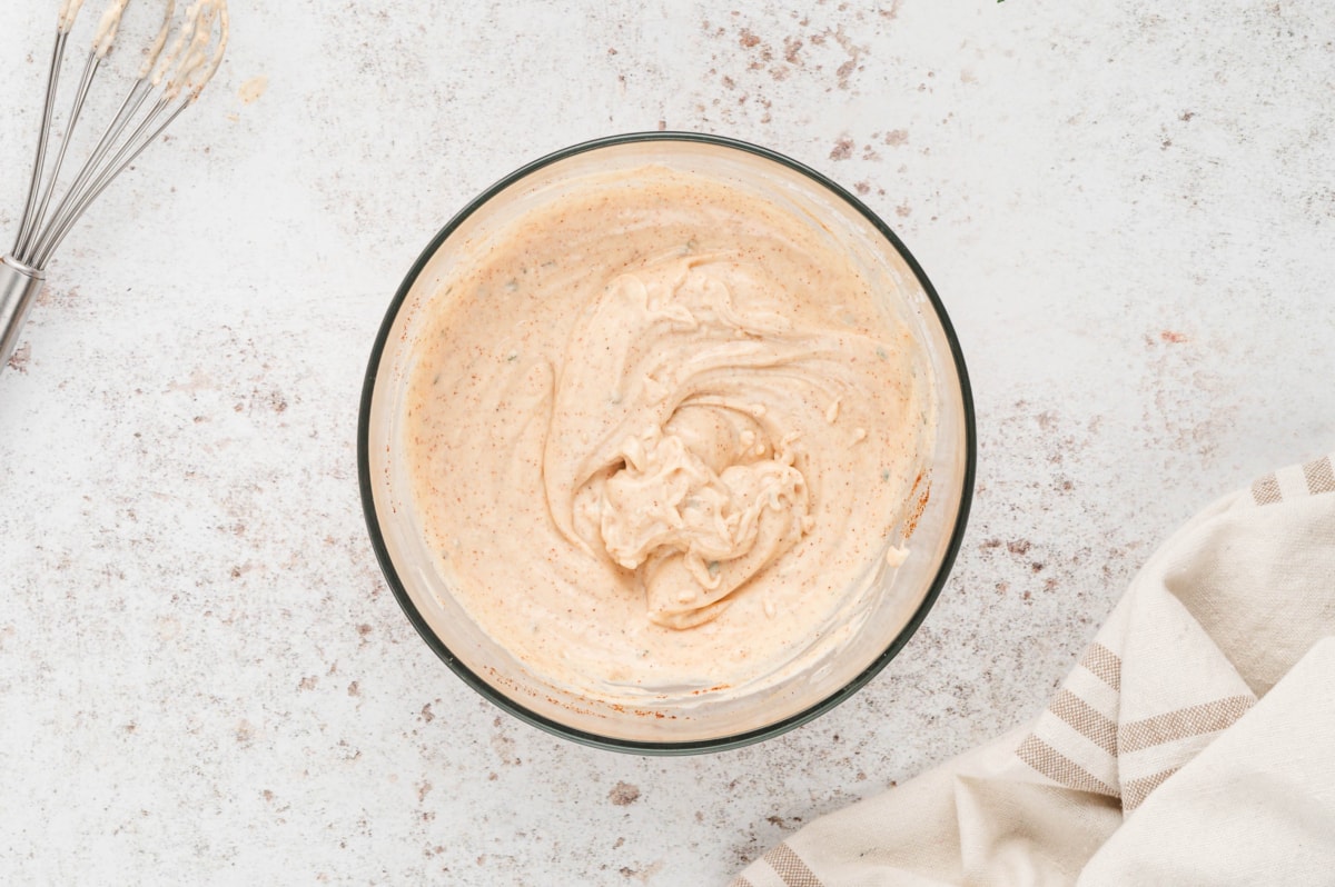 Creamy pink mayo sauce for burgers in a glass bowl.