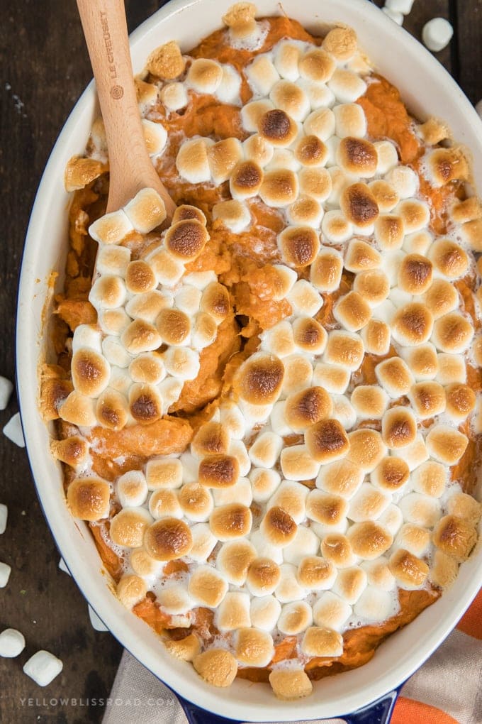 Sweet potato casserole with marshmallows in a baking dish.