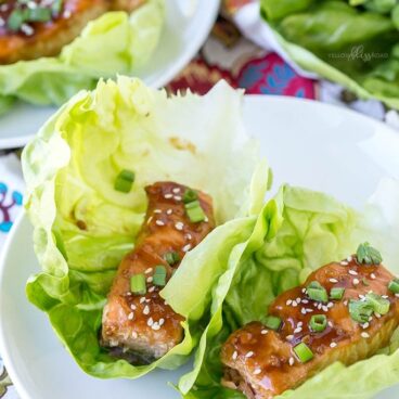 A plate of teriyaki salmon lettuce wraps